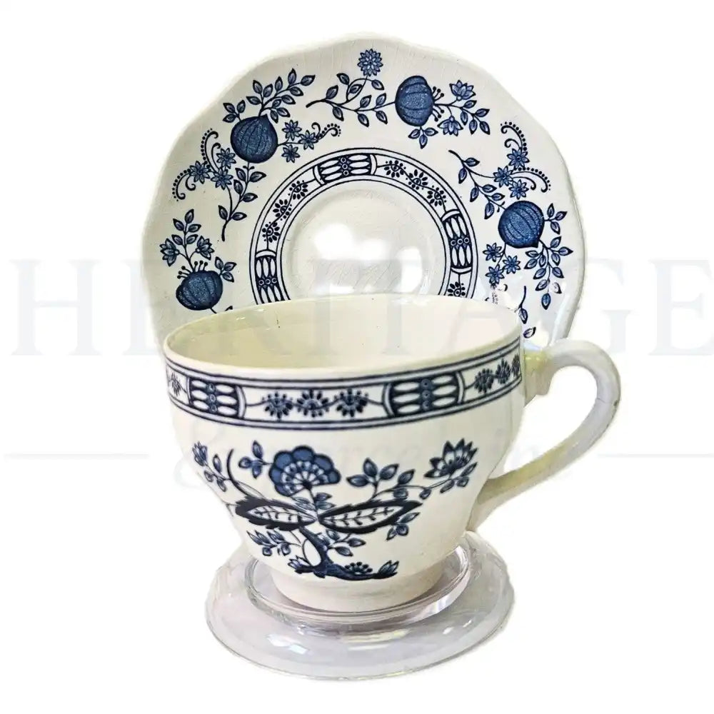 Wedgwood Blue Onion flat cup and saucer set featuring a classic blue and white floral pattern.