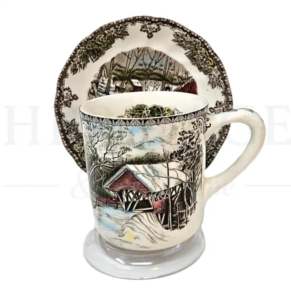 Johnson Brothers Friendly Village mug & saucer set featuring a classic vintage village scene pattern.