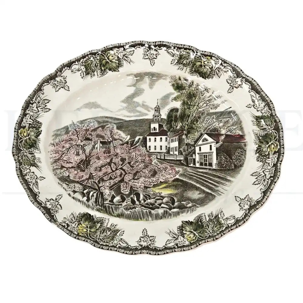 Johnson Brothers Friendly Village 11 3/4" oval serving platter featuring the classic vintage scenic pattern with a charming English countryside design.