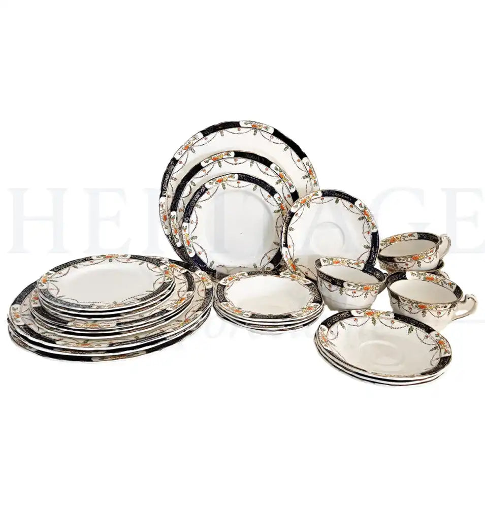 Vintage Alfred Meakin Solway 24-piece dinnerware set, made in England, including plates, bowls, flat cups and saucers for four.