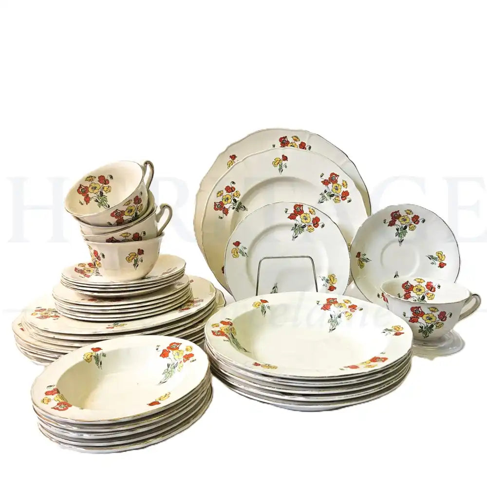 Alfred Meakin Royal Marigold 35-piece dinnerware set featuring a classic vintage decorative pattern.