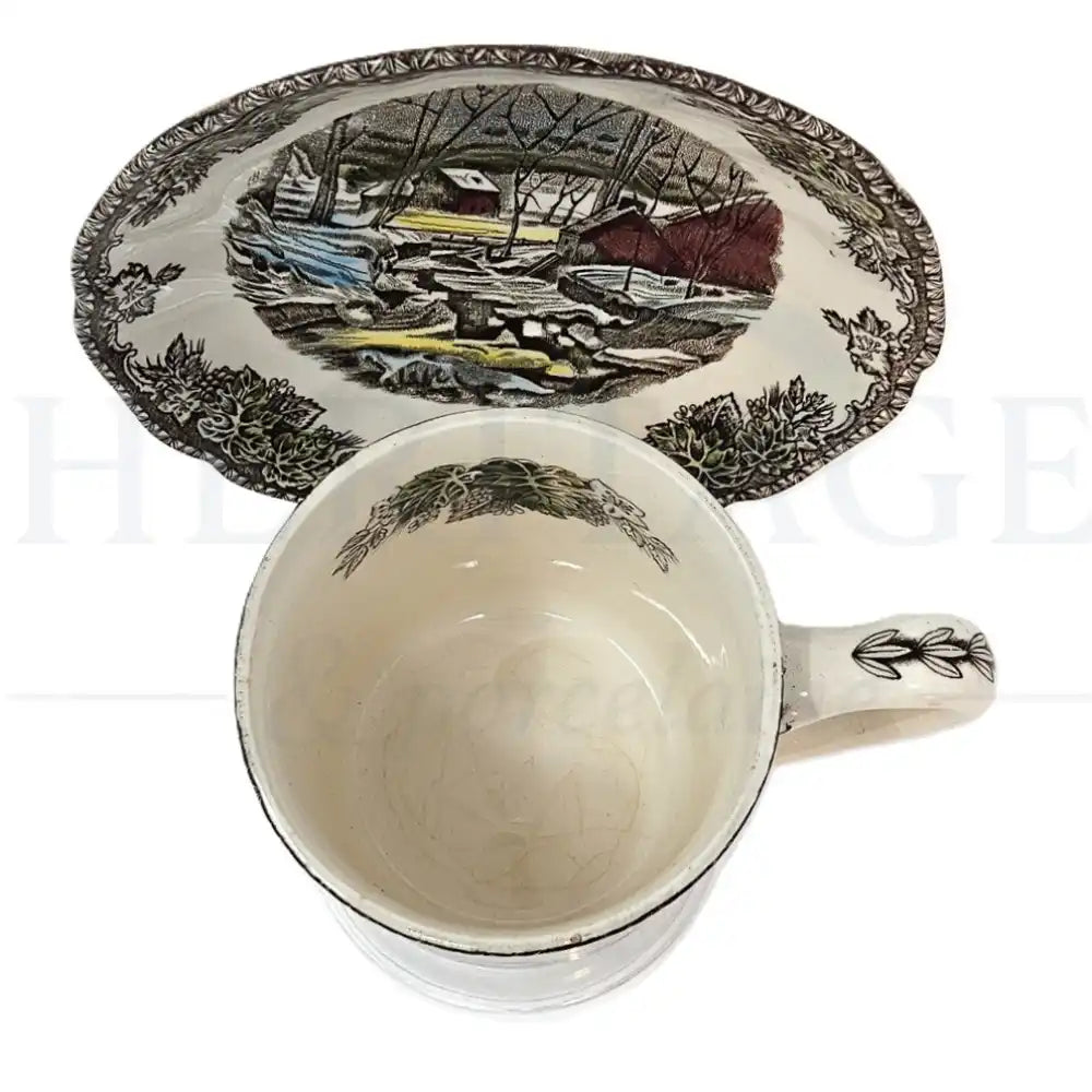 Johnson Brothers Friendly Village mug & saucer set featuring a classic vintage village scene pattern.