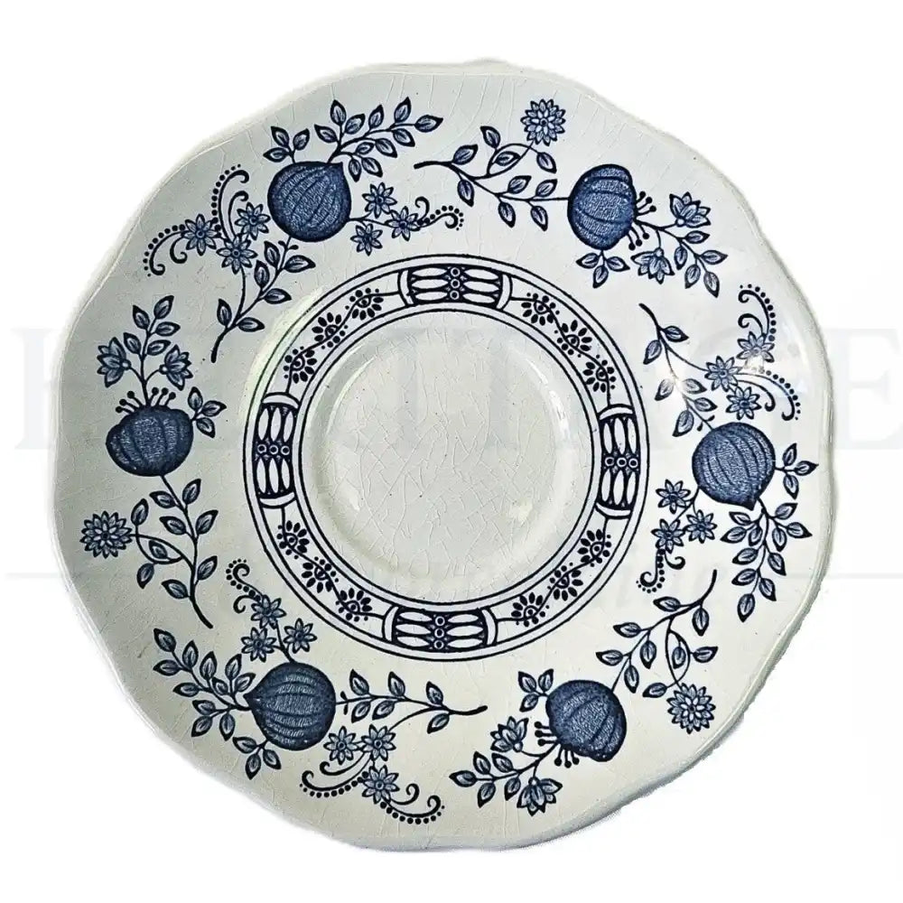 Wedgwood Blue Onion saucer featuring a classic blue and white floral pattern.