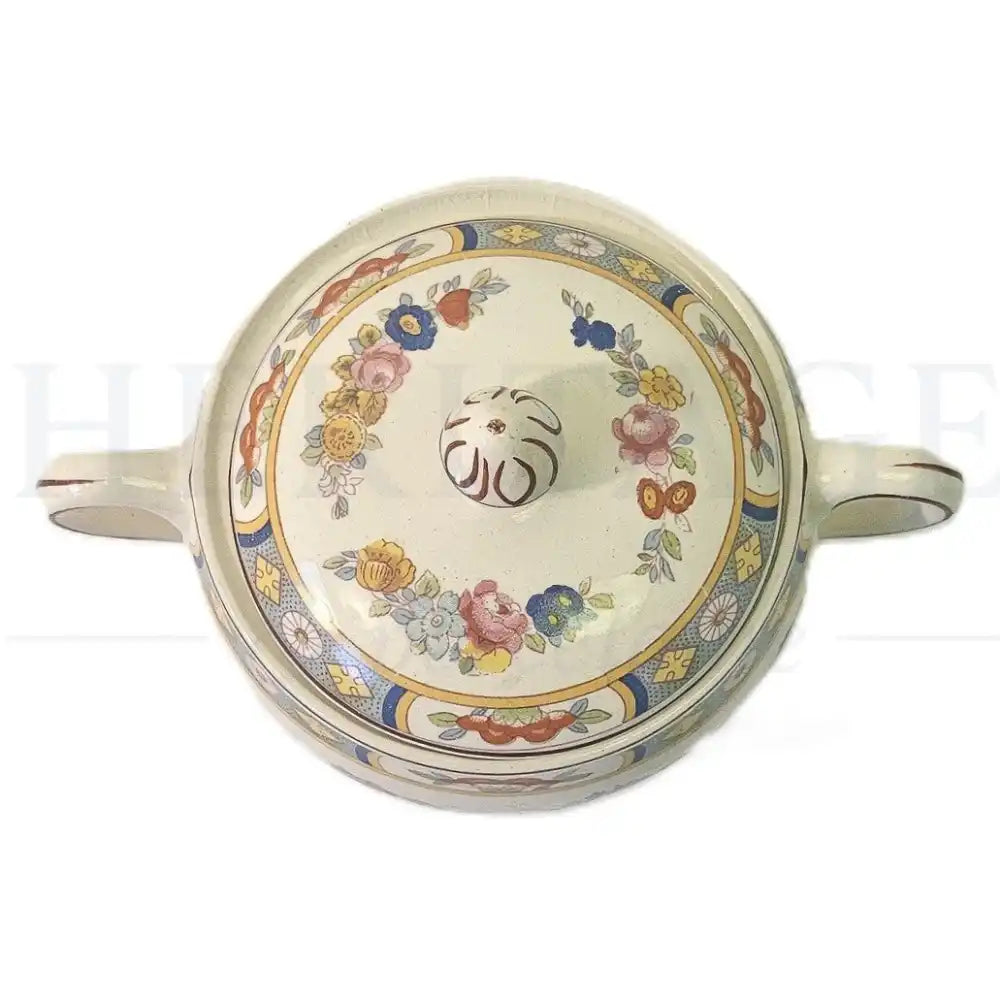 Johnson Brothers Arundale sugar bowl with lid featuring a classic floral pattern.